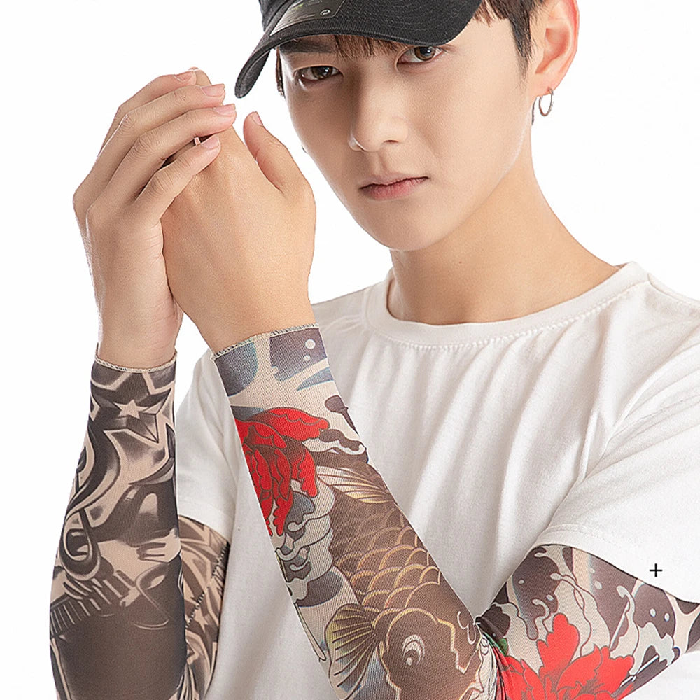 A person wearing white clothing is holding up a close-up of patterned UV protection arm sleeves.