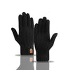 A pair of black knitted winter gloves shown against a white background.