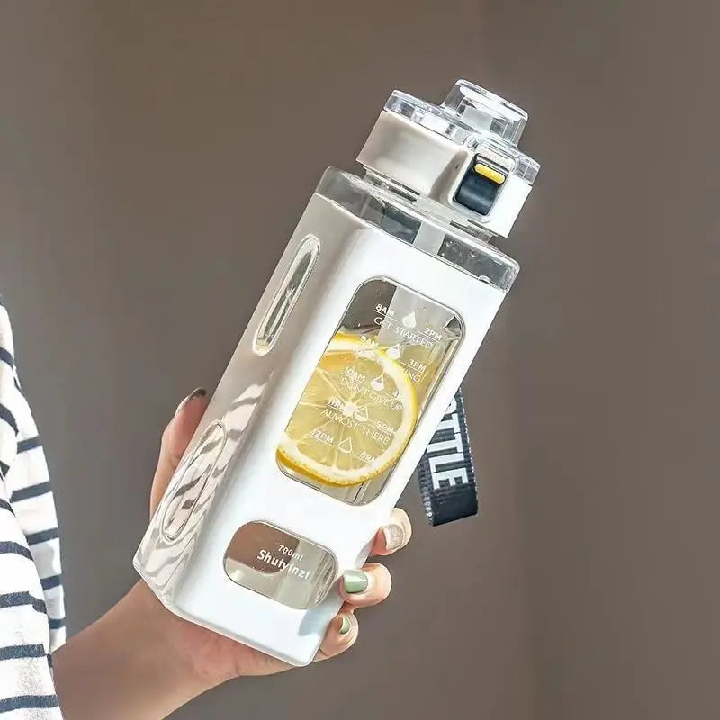 A hand holds a white leakproof sport water bottle with a clear cap and yellow accents against a neutral background.