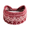 A close-up of a red and white patterned bohemian cotton stretch headband rolled into a coil.