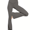 A model is wearing high-waist crossover flare leggings in a solid gray color.