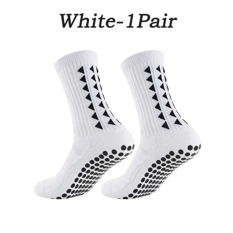 A pair of white multi-sport athletic grip socks shown flat.