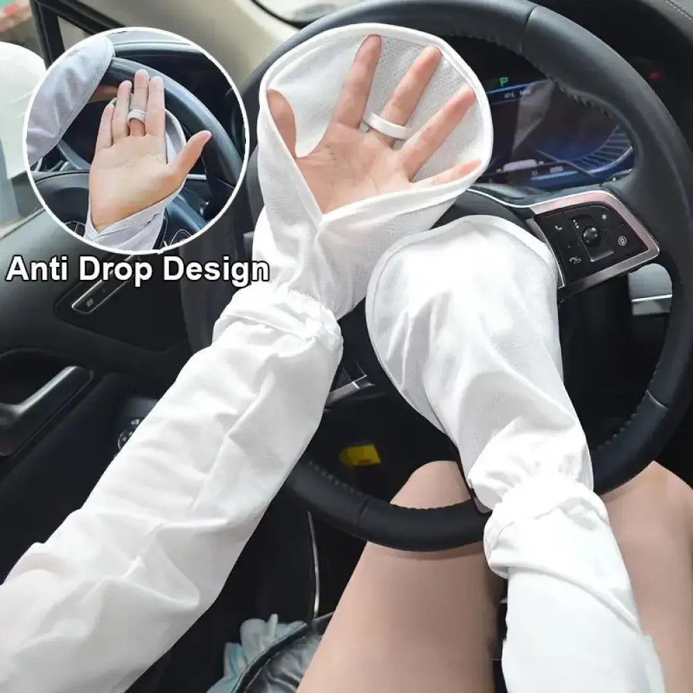 A person wearing white long-sleeved arm sleeves with an anti-drop design is shown gripping a car steering wheel.