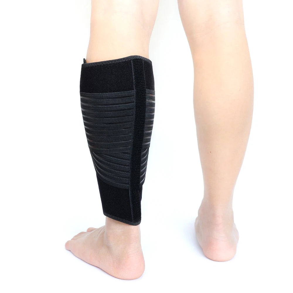 Black adjustable calf compression brace worn on a person's lower leg.