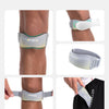 Display of an adjustable knee strap for tendon support shown on a leg and hand.