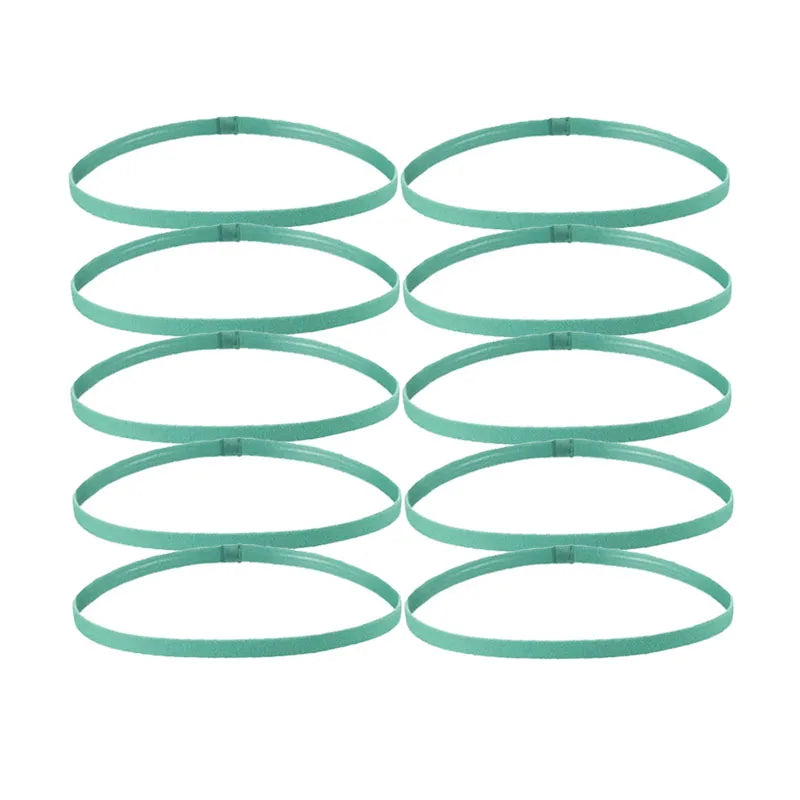 A set of five green elastic sports headbands laid out in a row.