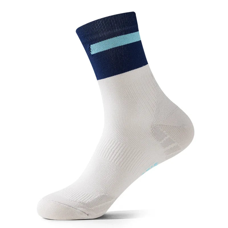 A white performance athletic running sock with a navy cuff and light blue stripe.