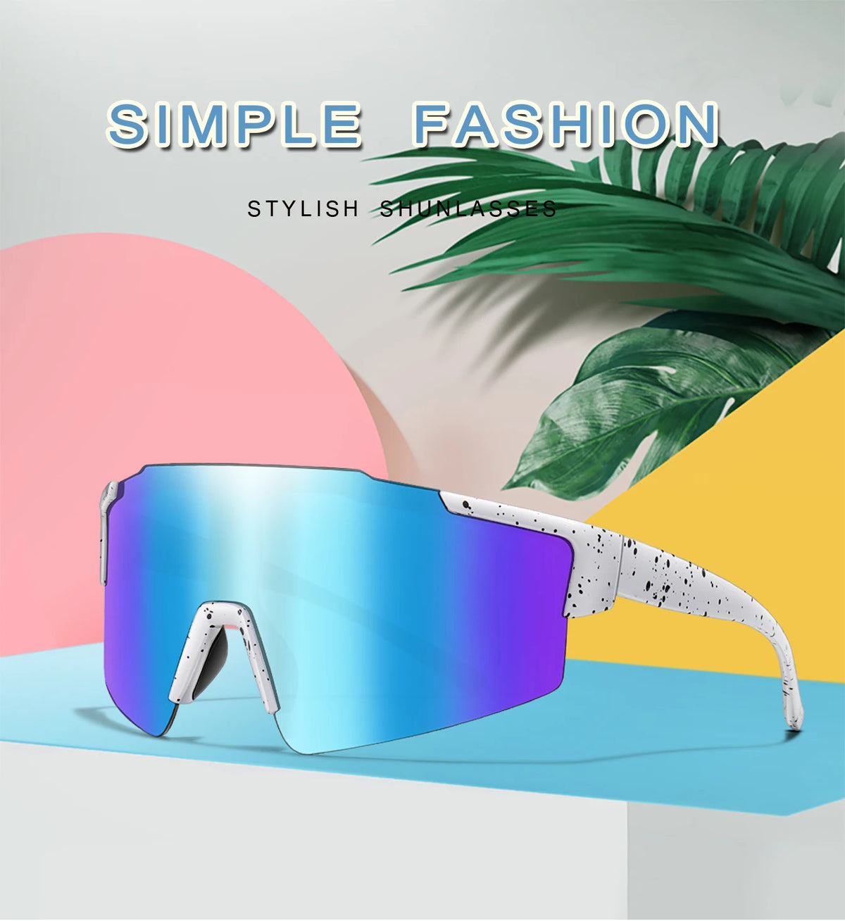 A pair of blue and purple tinted sunglasses resting on a light blue surface with tropical leaves in the background.