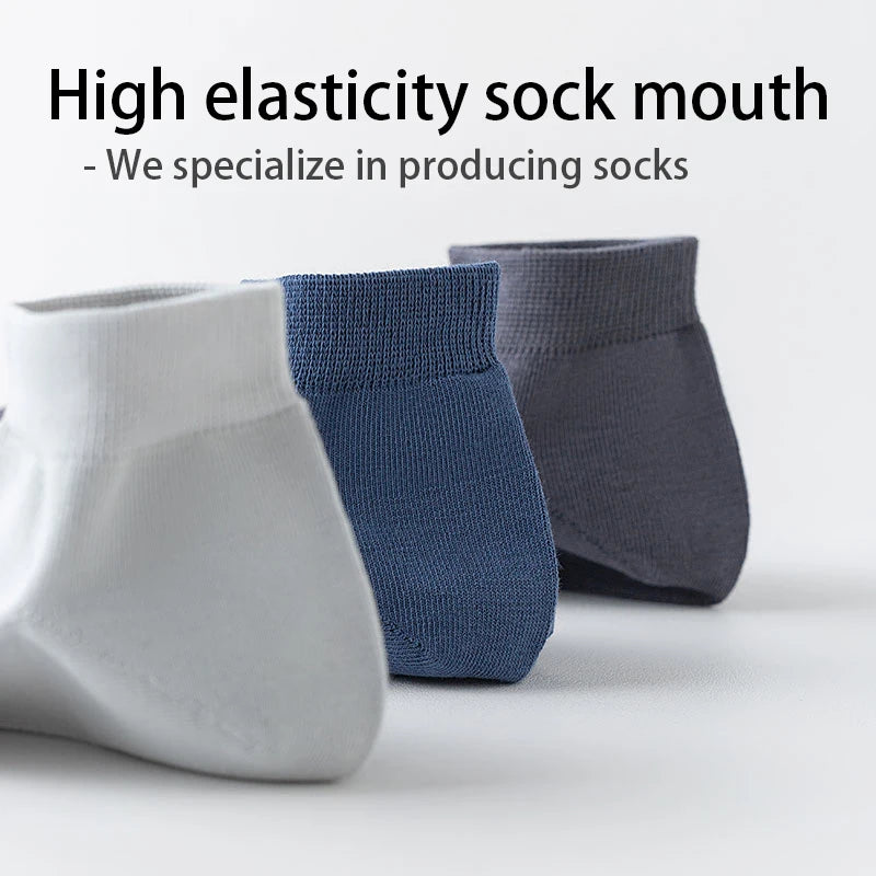 A close-up of three pairs of high elasticity sock mouths in white, blue, and gray fabric.