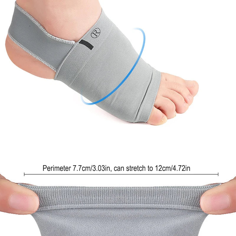 Gray silicone arch support insoles being stretched to show flexibility and fit