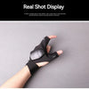 A hand wearing tactical gloves is holding a multi-use LED flashlight.