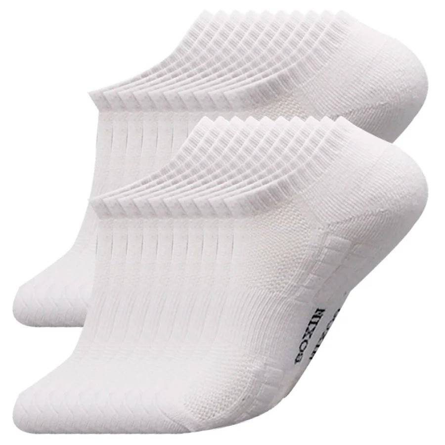 A pair of white men's essential warm socks stacked together.
