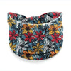 Diadema de yoga bohemio colorido con estampado floral de hojas rojas, amarillas y azules.
