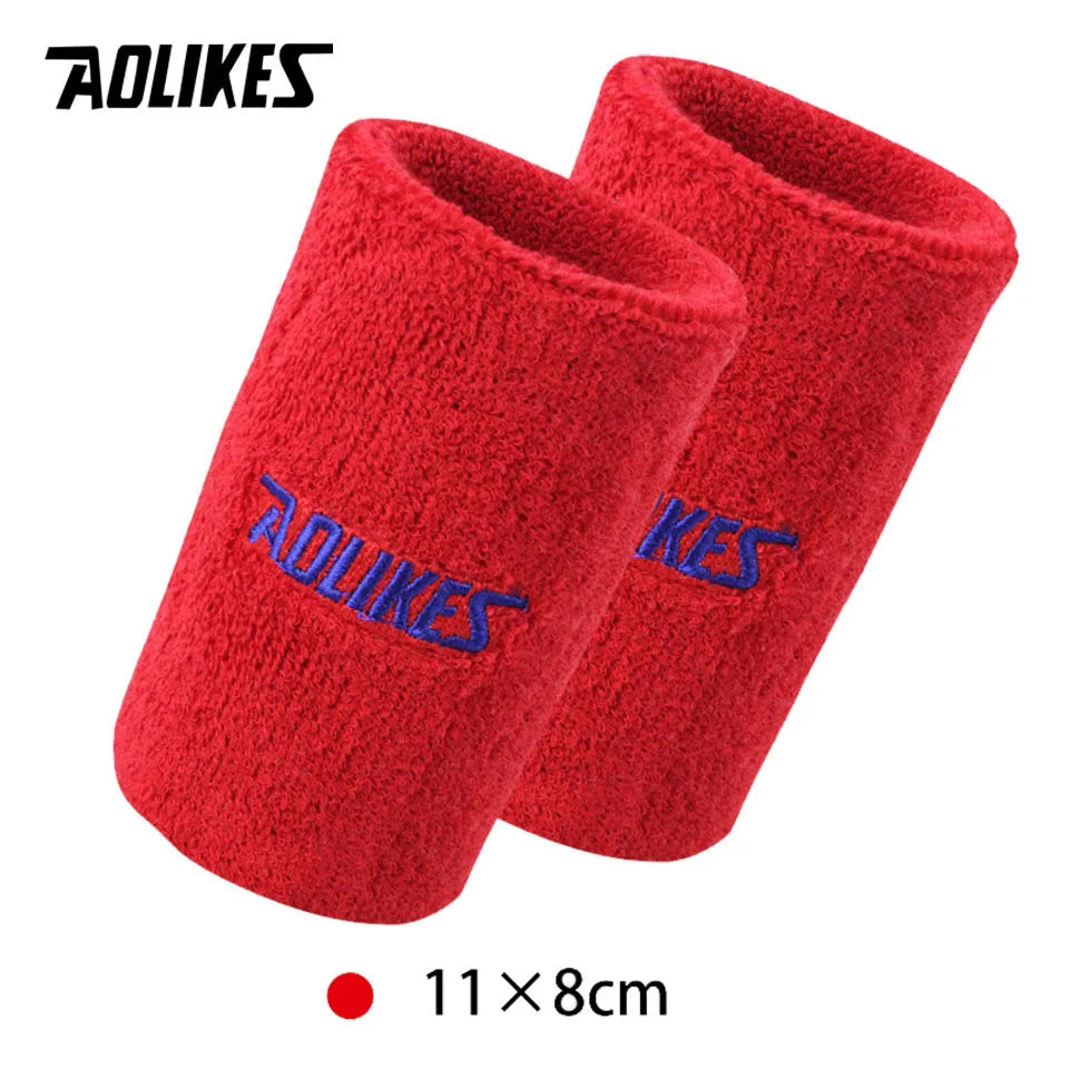 A pair of red fuzzy sport wristbands with the AOLIKES logo visible.