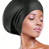 A woman wearing a black silicone swim cap for long hair and braids.