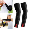 Black protective arm sleeves being worn by a woman outdoors for sports or outdoor activities