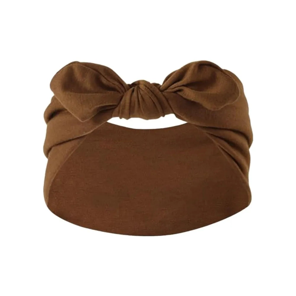 A brown fabric headband tied in a bow, suitable for a bohemian bunny ear style.
