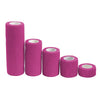 Several rolls of bright pink elastic tattoo grip tape for finger and wrist protection