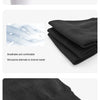 Black compression leg sleeves shown on a hand and folded fabric, highlighting elastic weaving and sweat channels.