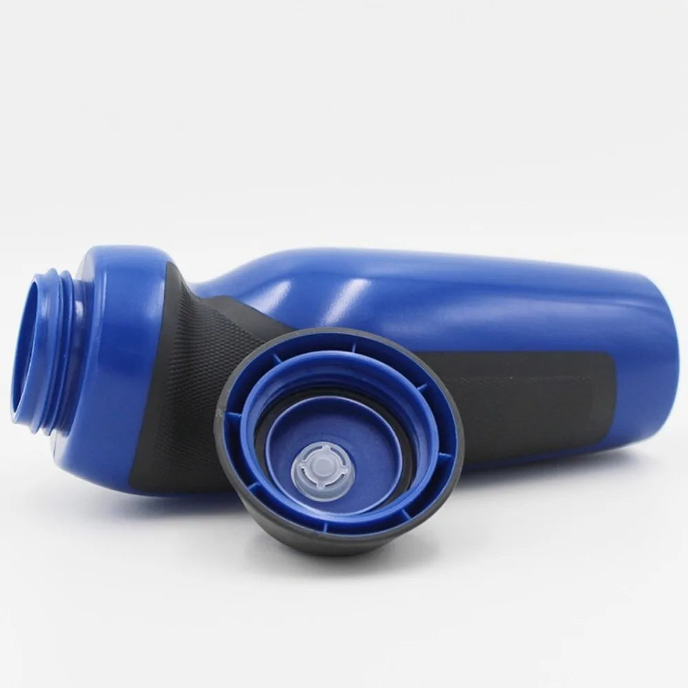 A blue durable squeeze water bottle with a black cap and nozzle, shown from the side.