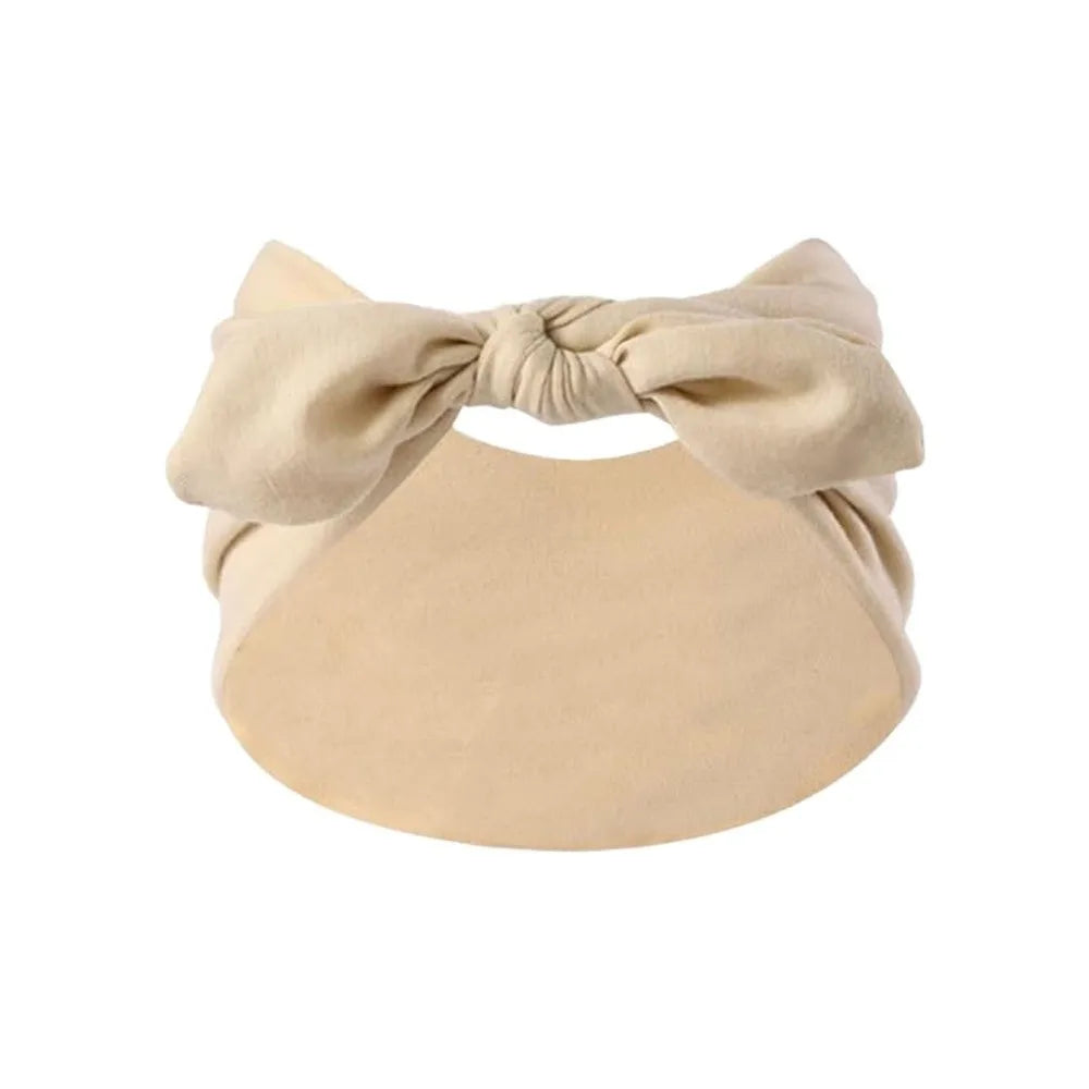 A beige bohemian bunny ear headband with a bow detail.
