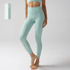 Un mannequin porte des leggings de performance taille haute vert menthe clair.