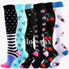 A collection of medical grade compression socks in various colors and patterns, including black, light blue, and white.