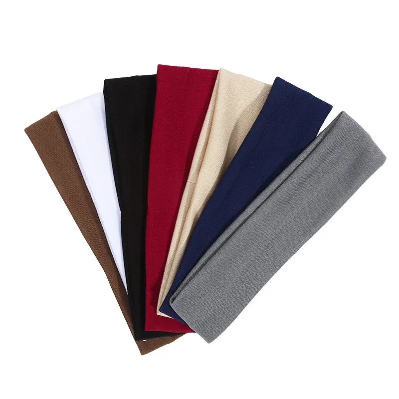 A set of solid elastic hair bands in various colors including black, maroon, beige, and navy.