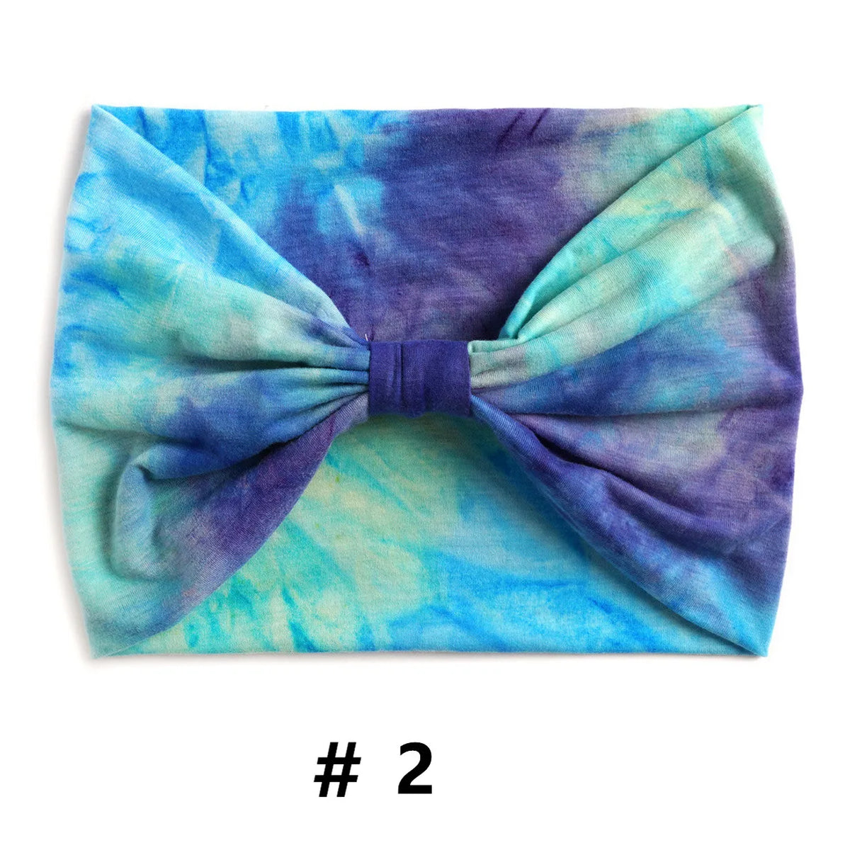Bandeau en coton tie-dye violet et bleu noué en nœud.