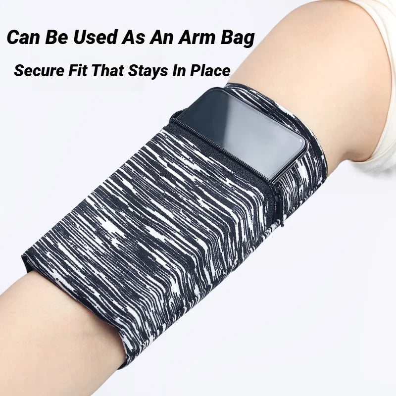A black and white striped zippered wrist bag is shown secured on a person's arm.