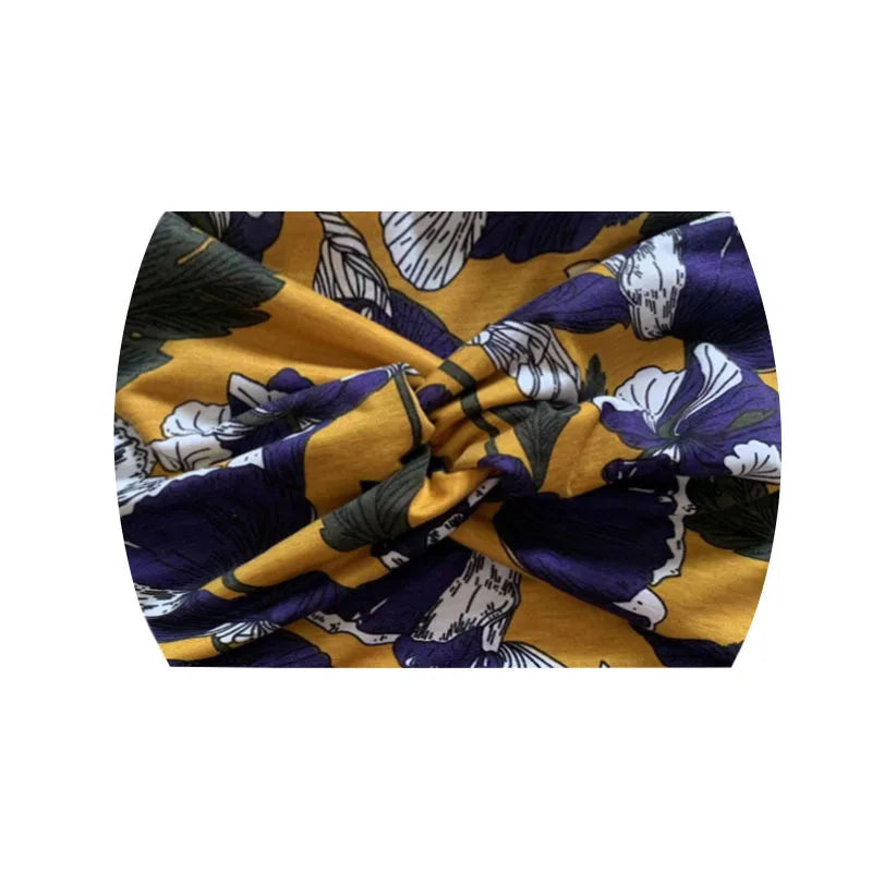 Élastique de sport à motif floral jaune et violet, noué en nœud.