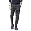 Men's camouflage elastic waist drawstring pants shown on a model.