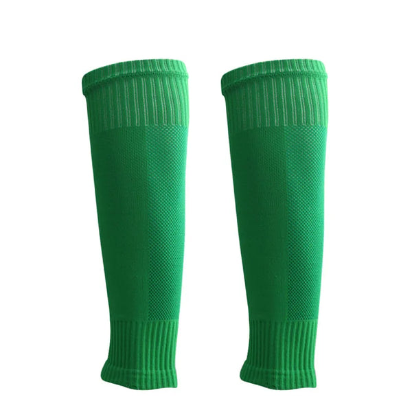 A pair of green professional football shin guards and leg warmers.