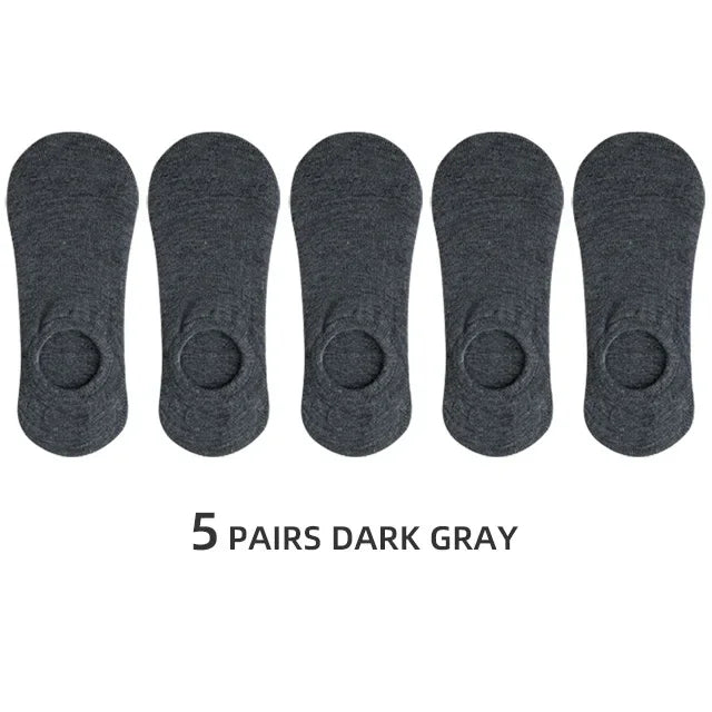 Five pairs of dark gray men's invisible silicone no-show socks laid out in a row.