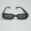 Black sunglasses with spiked rivets on the frame for men and women