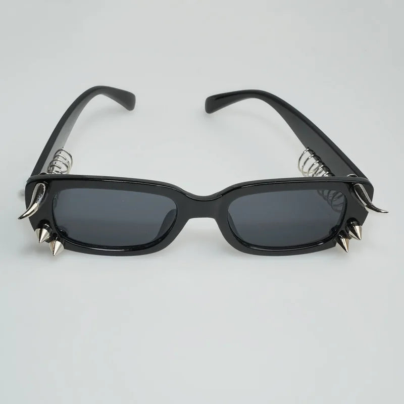 Black sunglasses with spiked rivets on the frame for men and women