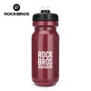 A maroon sports water bottle with a black cap and white top, branded with the ROCKBROS logo.