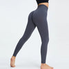 A model wearing dark gray high-waist seamless yoga leggings and a black top, shown in a side view.