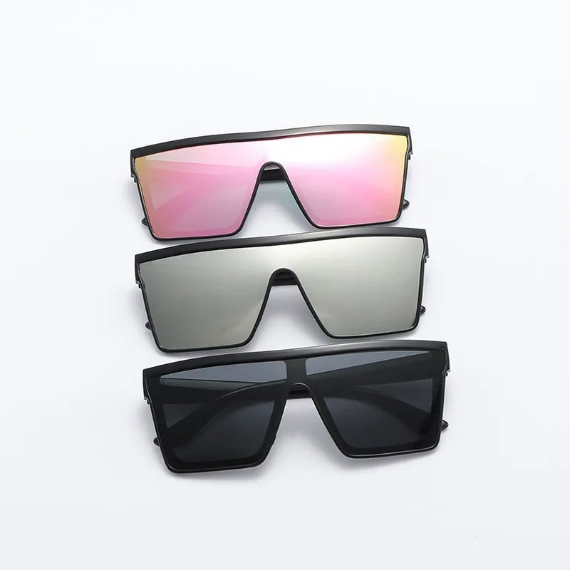 A set of three retro square sunglasses in pink, silver, and black.