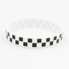 White silicone wristband with a black and white checkered pattern.