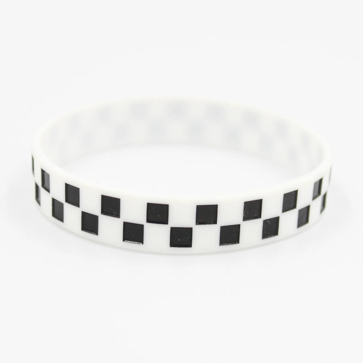 White silicone wristband with a black and white checkered pattern.