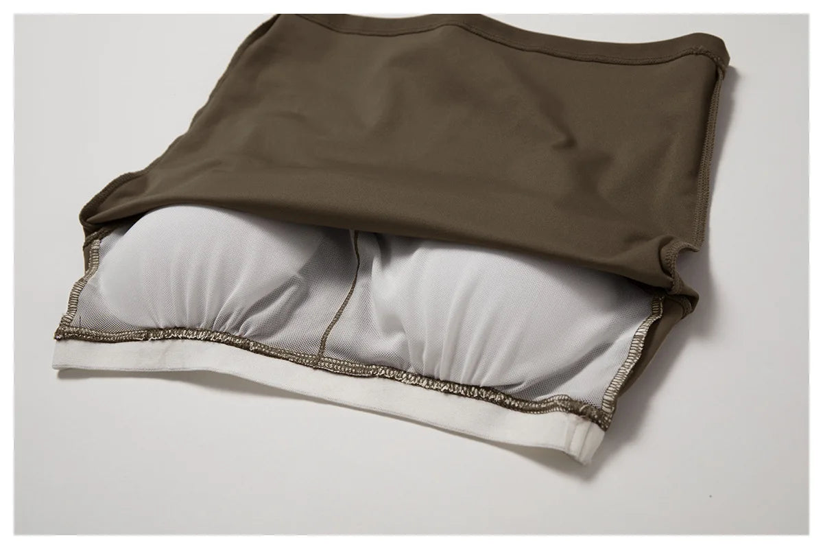 A brown women's performance tracksuit top and matching bottoms laid flat.
