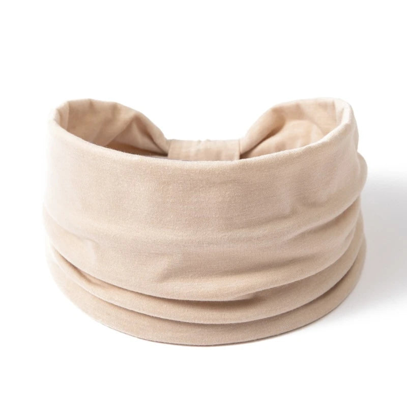 A beige boho wide headband hair wrap for women shown flat.
