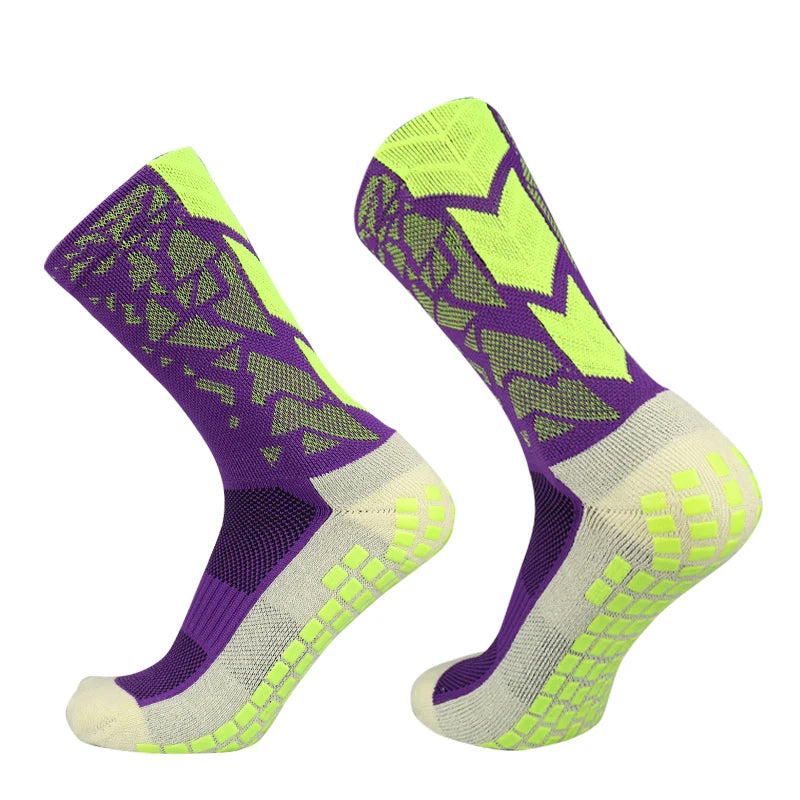 A pair of neon yellow and purple anti-slip training socks shown from the side.