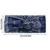 Diadema elástica de tela azul marino con estampado de paisley blanco