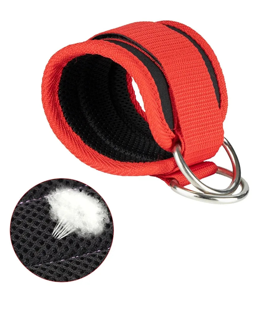 A bright orange neoprene ankle strap with black trim and a small piece of white foam visible.
