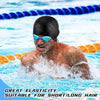 A man wearing a black swimming cap is splashing water during a swim test.