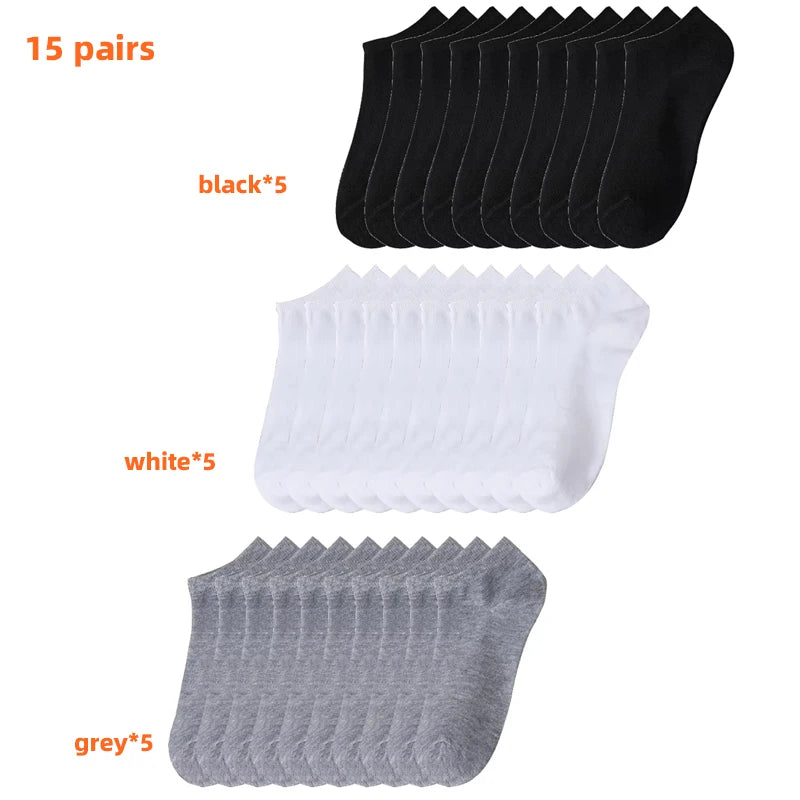 Un paquete de 15 pares de calcetines casuales transpirables para barco en colores negro, blanco y gris.