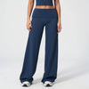A model wearing navy blue flared high-waist yoga pants and a matching crop top.