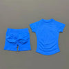 A bright blue seamless yoga set for women featuring a short sleeve top and workout shorts.